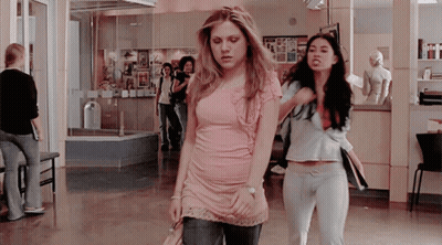 Women In Pink And Blue Shirts GIF