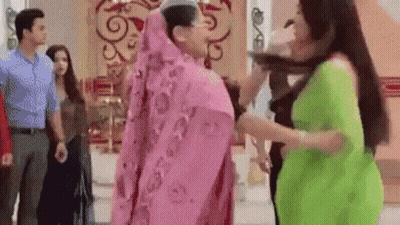 Women In Pink And Green Dresses Standing GIF