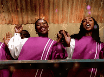 Women In Purple And White Robes Singing GIF