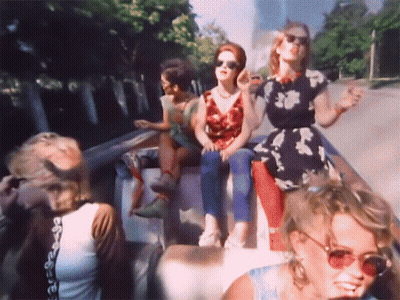 Women In Sunglasses On Back Of Truck GIF