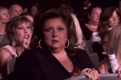 Women In Theater Watching Show Holding RLC Ticket GIF