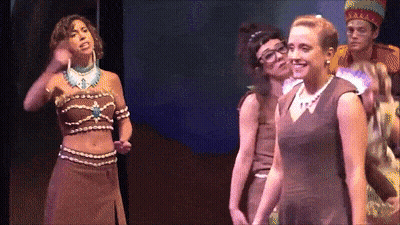 Women On Stage One Wearing Necklace With Letter A GIF