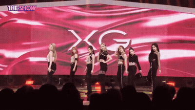 Women On Stage With XG Screen GIF