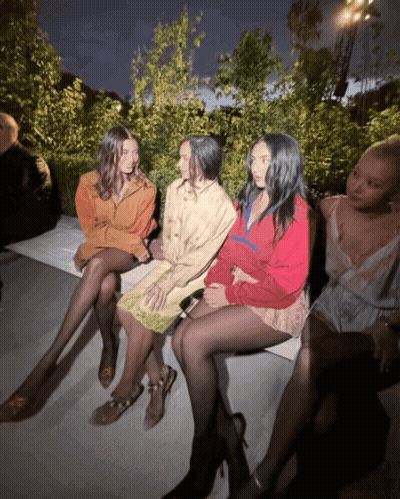 Women Sitting On Bench One In Red Jacket GIF