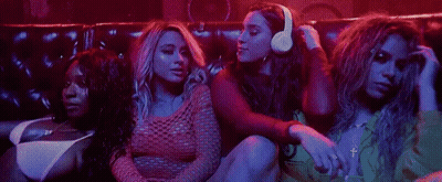 Women Sitting On Couch In Dark Room GIF