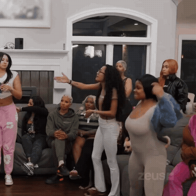 Women Sitting On Couch With Zeus GIF