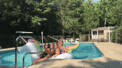 Women Sitting On Unicorn Float GIF