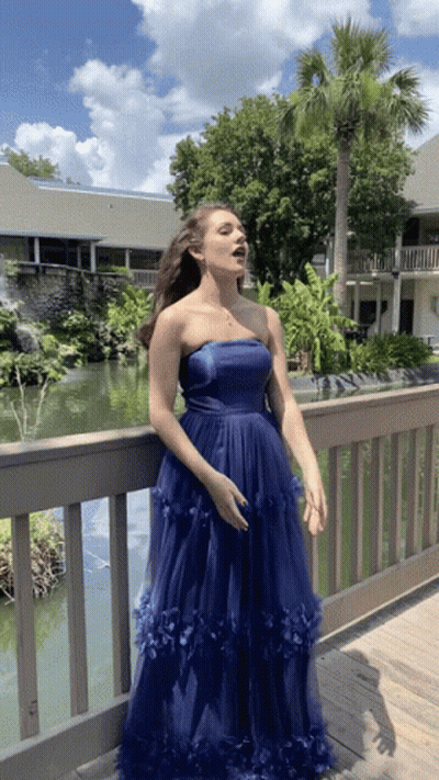 Women Standing In Dress Store GIF
