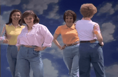 Women Standing In Front Of Blue Sky With Clouds GIF