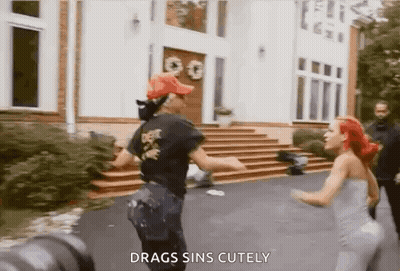 Women Standing In Front Of House GIF
