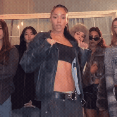 Women Standing In Front Of Mirror GIF