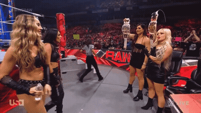 Women Standing In Front Of Raw Ring GIF