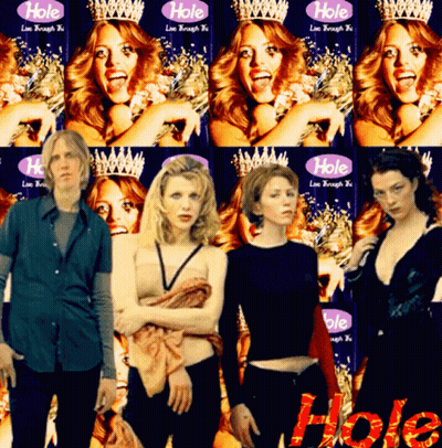 Women Standing In Front Of Wall Saying Hole GIF