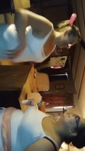 Women Standing Next To Each Other GIF