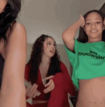 Women Standing Next To Each Other GIF