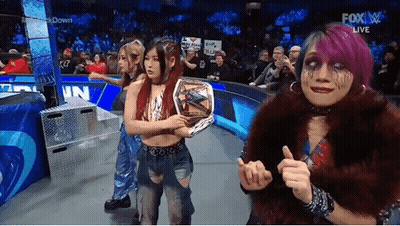 Women Standing On Stage Holding Championship Belt GIF