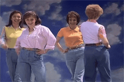 Women Standing Under Cloudy Sky GIF