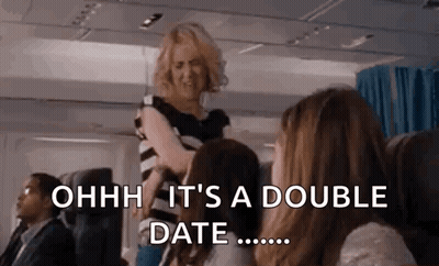 Women Talking On Airplane GIF
