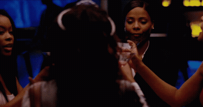 Women Toasting With Martinis In Dark Room GIF