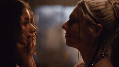 Women Touching Faces Looking At Each Other GIF