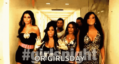 Women Walking And Waving In Hallway GIF