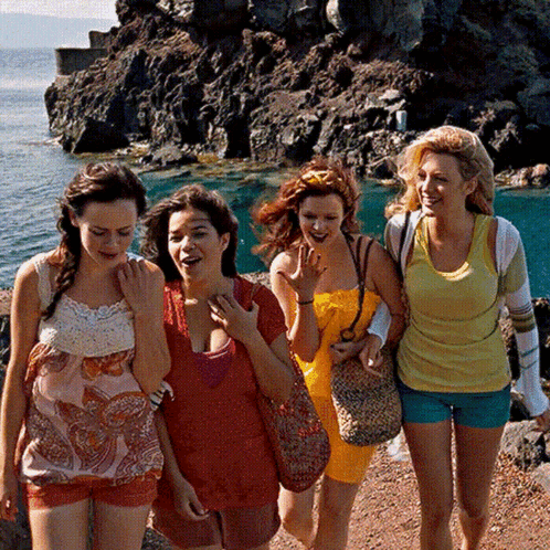 Women Walking Rocky Shoreline GIF