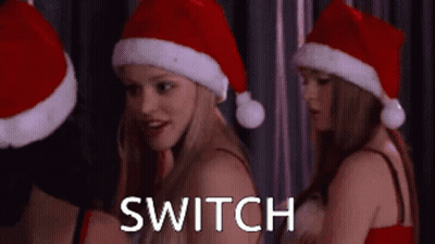 Women With Santa Hats Switch GIF