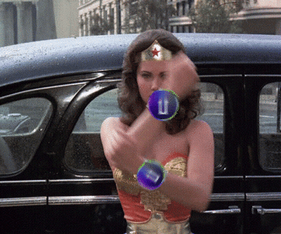 Wonder Woman Costume Standing In Front Of Car With Letter U On Arm GIF