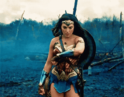 Wonder Woman Holding Sword And Shield In Field GIF