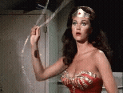 Wonder Woman Is Holding A Rope In Her Hand . GIF