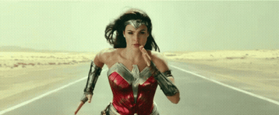 Wonder Woman Running Down Desert Road Holding Sword GIF