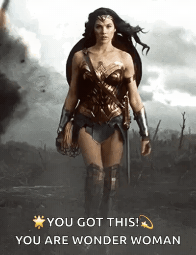 Wonder Woman Walking Through Field With Shield And Sword GIF