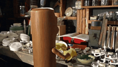 Wooden Block With Knife Sticking Out GIF