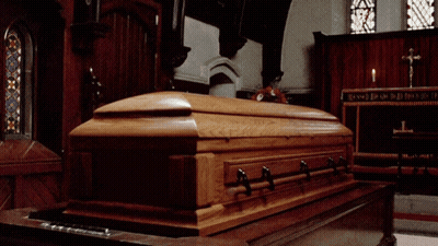 Wooden Coffin In Church With Cross GIF