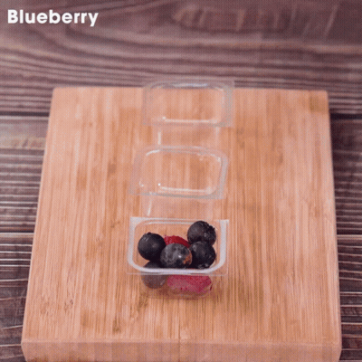 Wooden Cutting Board With Blueberries And Raspberries GIF