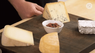 Wooden Cutting Board With Cheeses And Sauce Number 52 GIF