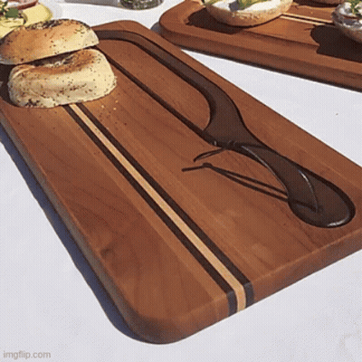 Wooden Cutting Board With Knife And Bagel GIF
