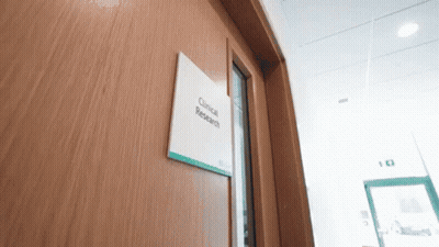 Wooden Door With Clinical Research Sign GIF