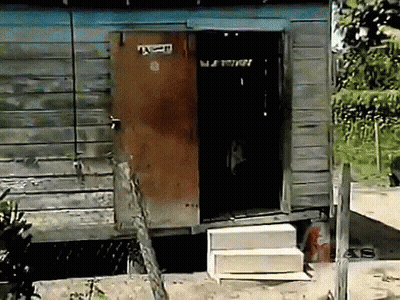Wooden Door With Sticker Saying A GIF