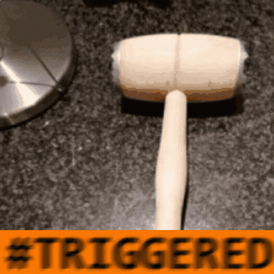 Wooden Hammer Next To Triggered Sign GIF