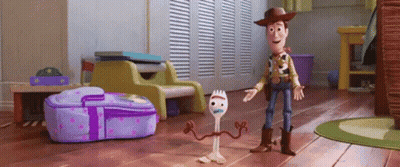 Woody And Forky From Toy Story 4 Are Standing Next To Each Other GIF