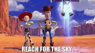 Woody And Jessie From Toy Story Are Standing Next To Each Other In The Desert While Buzz Lightyear Is Flying In The Sky  GIF