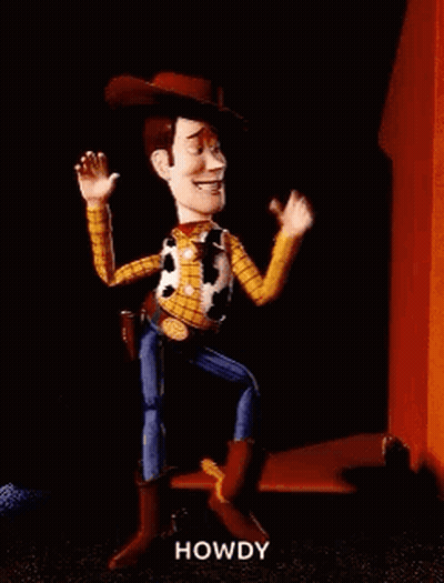 Woody From Toy Story Is Dancing In Front Of A Red Building . GIF
