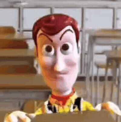 Woody From Toy Story Is Holding A Piece Of Cardboard In A Classroom . GIF