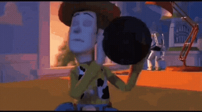 Woody From Toy Story Is Holding Buzz Lightyear In His Arms GIF