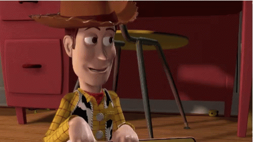 Woody From Toy Story Sits On The Floor With His Feet Up GIF
