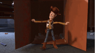 Woody From Toy Story Standing In A Doorway GIF