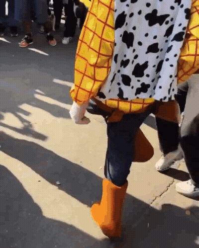 Woody From Toy Story Walking Down Street GIF