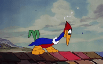 Woody Woodpecker Standing On Roof With Lightning Bolt Out Of Mouth GIF