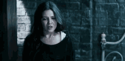 Worried Danielle Campbell With Chained Hands GIF